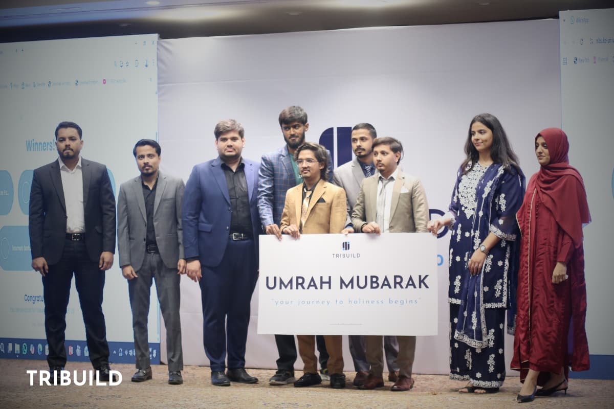 Colleagues receiving sponsored Umrah trips at the Tribuild annual dinner